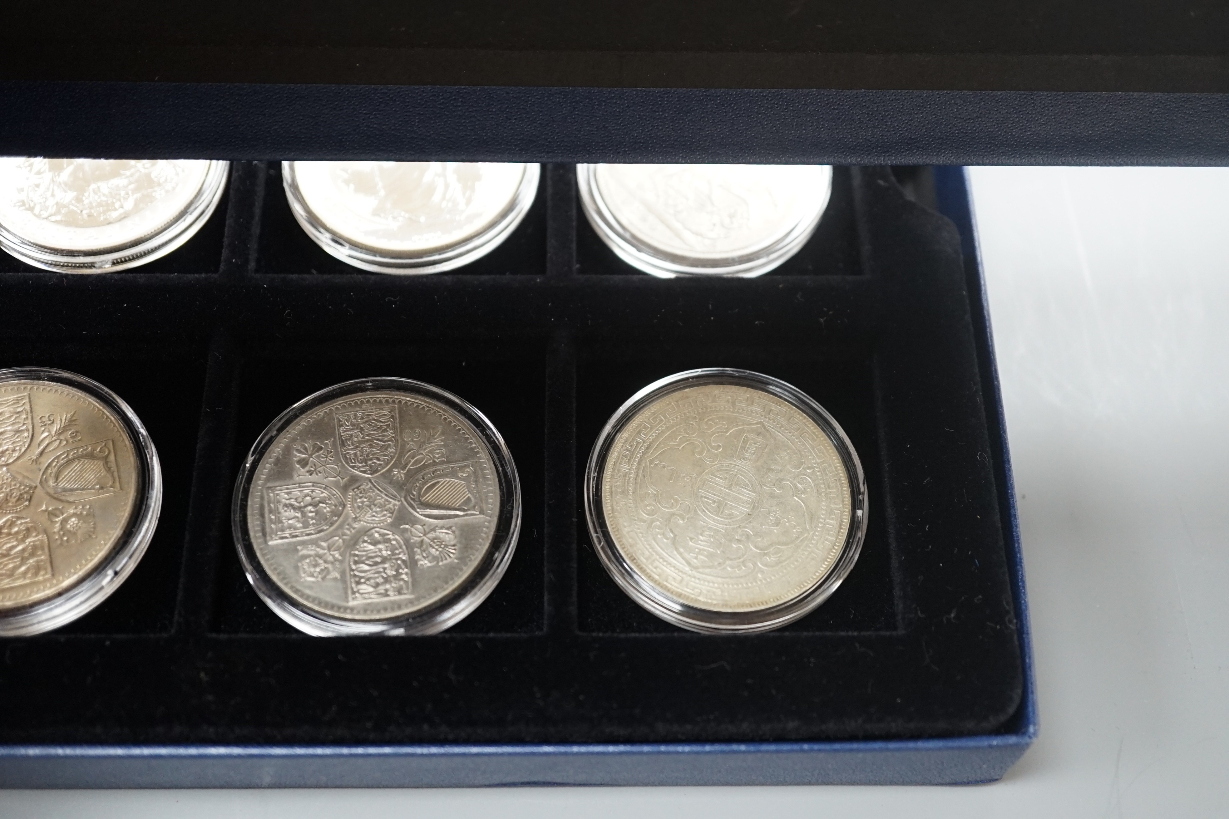 A group of coins including 1898 British Trade One Dollar, Royal Mint UK two QEII five shillings, 1935 crown, 1890 crown, silver proof coins - five 1oz. silver Britannia £2 coins 1998-2000, 2003, 2004, 2002 Queen Mother £